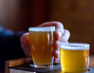 Man holding a cold IPA