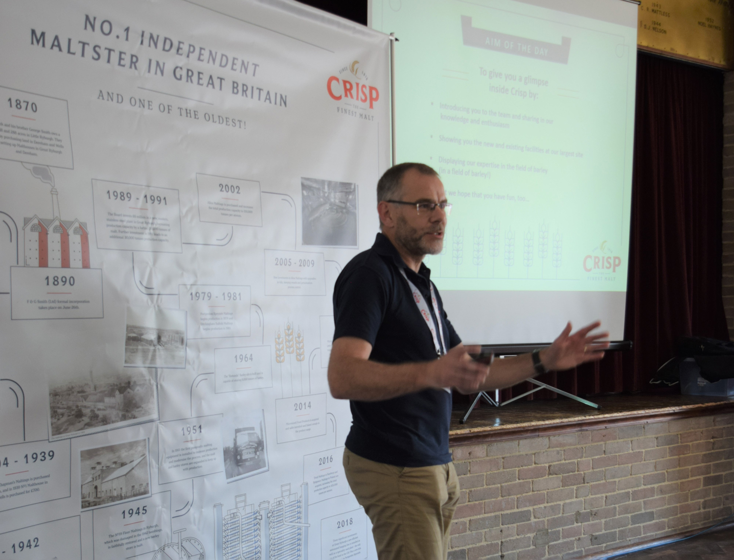 Steve Lepoidevin introducing the Crisp Malt team at the Maltings Open Day in front of a historical timeline of the company.