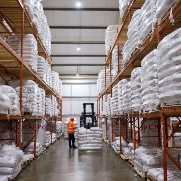 Crisp Malt malting barley sacks stacked in the Great Ryburgh warehouse.